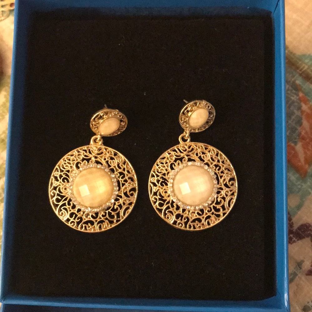 Golly tone earrings
